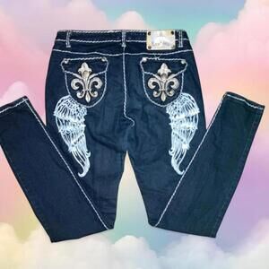 Raw blue jeans with white stitching and angel wings design.